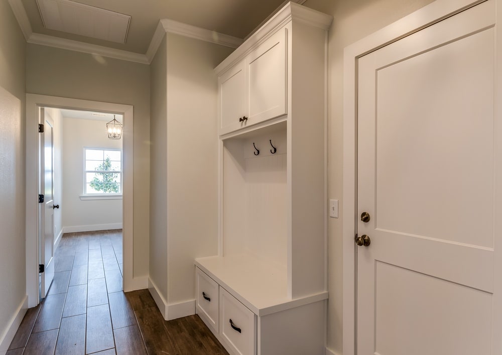 White mudroom with drawers and cabinets
