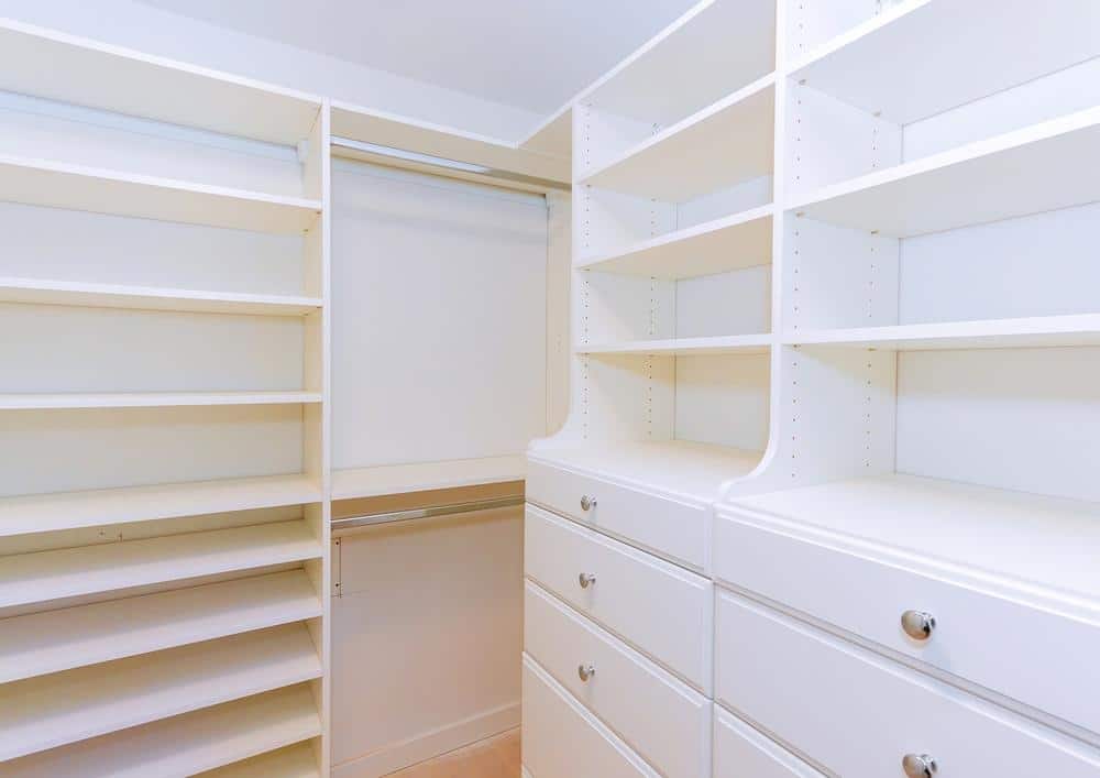White empty open pantry shelves and drawers