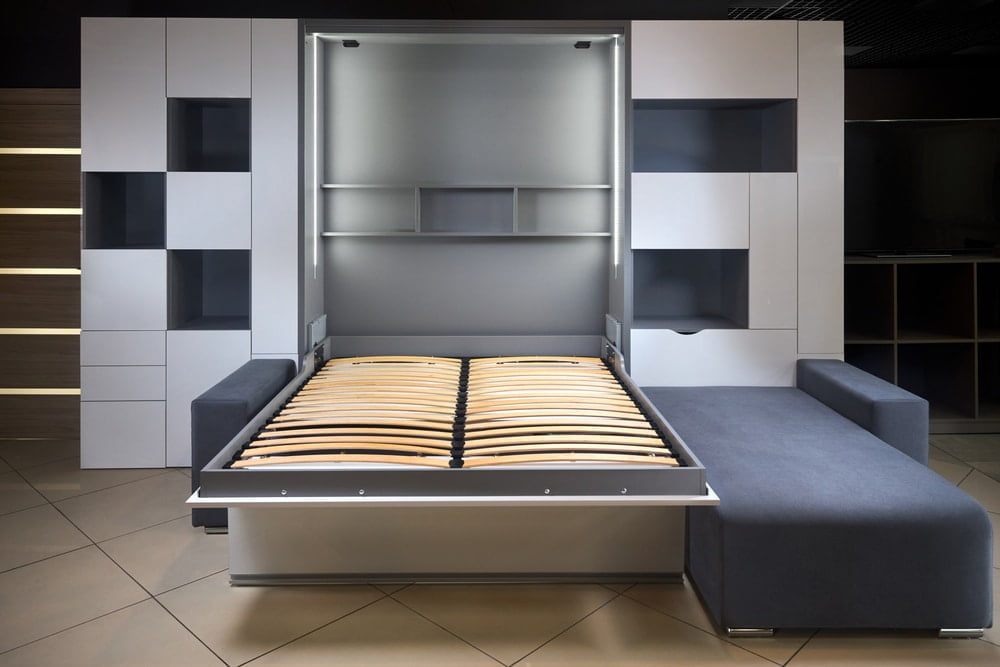 Modern murphy bed folded out from its cabinet