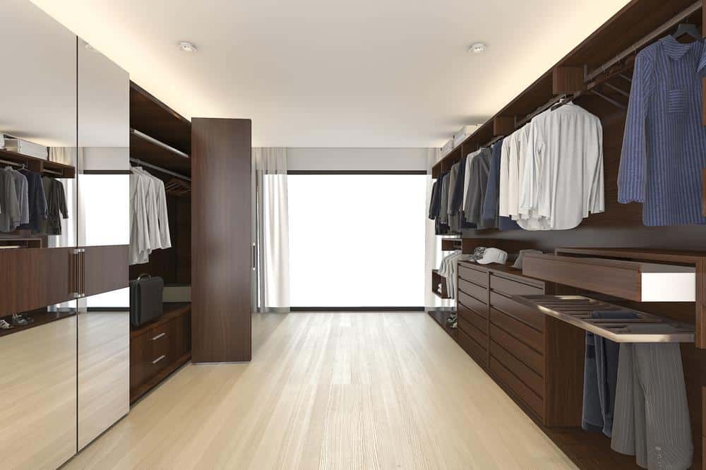 Modern large custom walk in closet with mirror doors