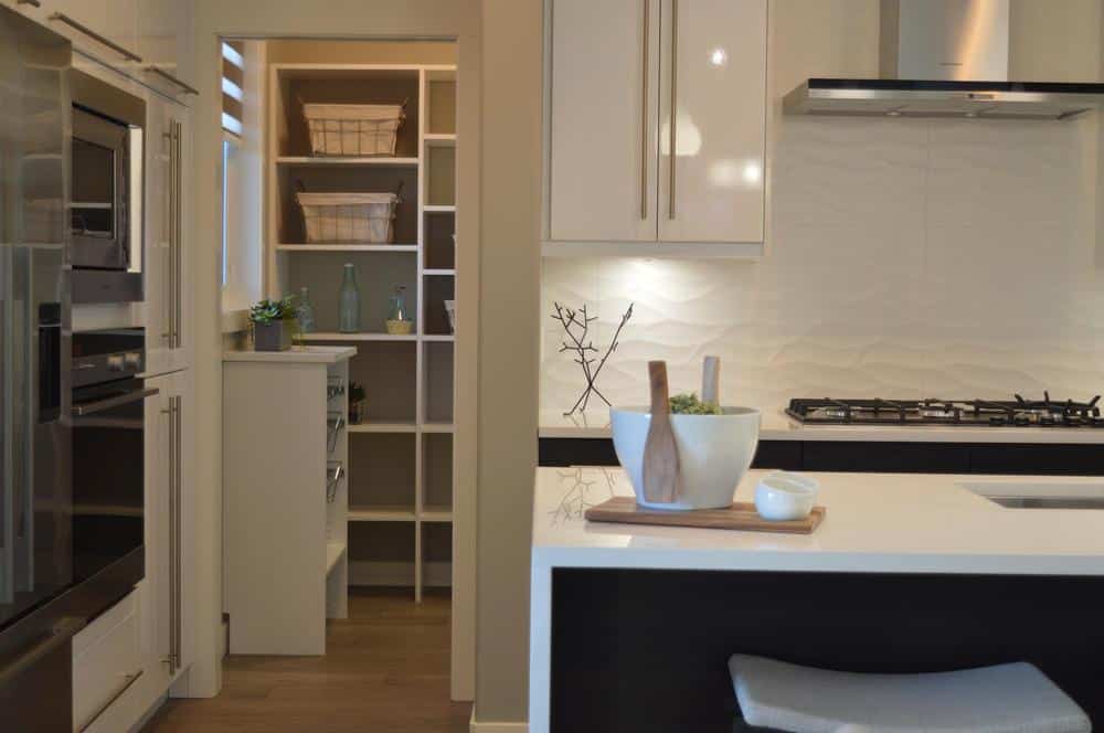 White multi-compartment pantry in the kitchen