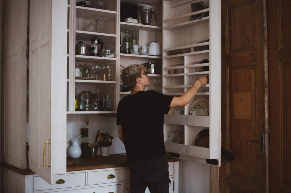 White multi-compartment pantry in the kitchen