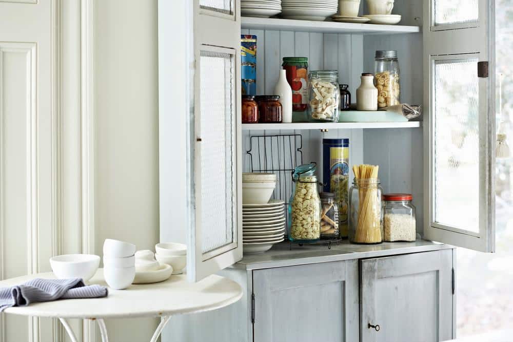 Light colored pantry shelves in a kitchen