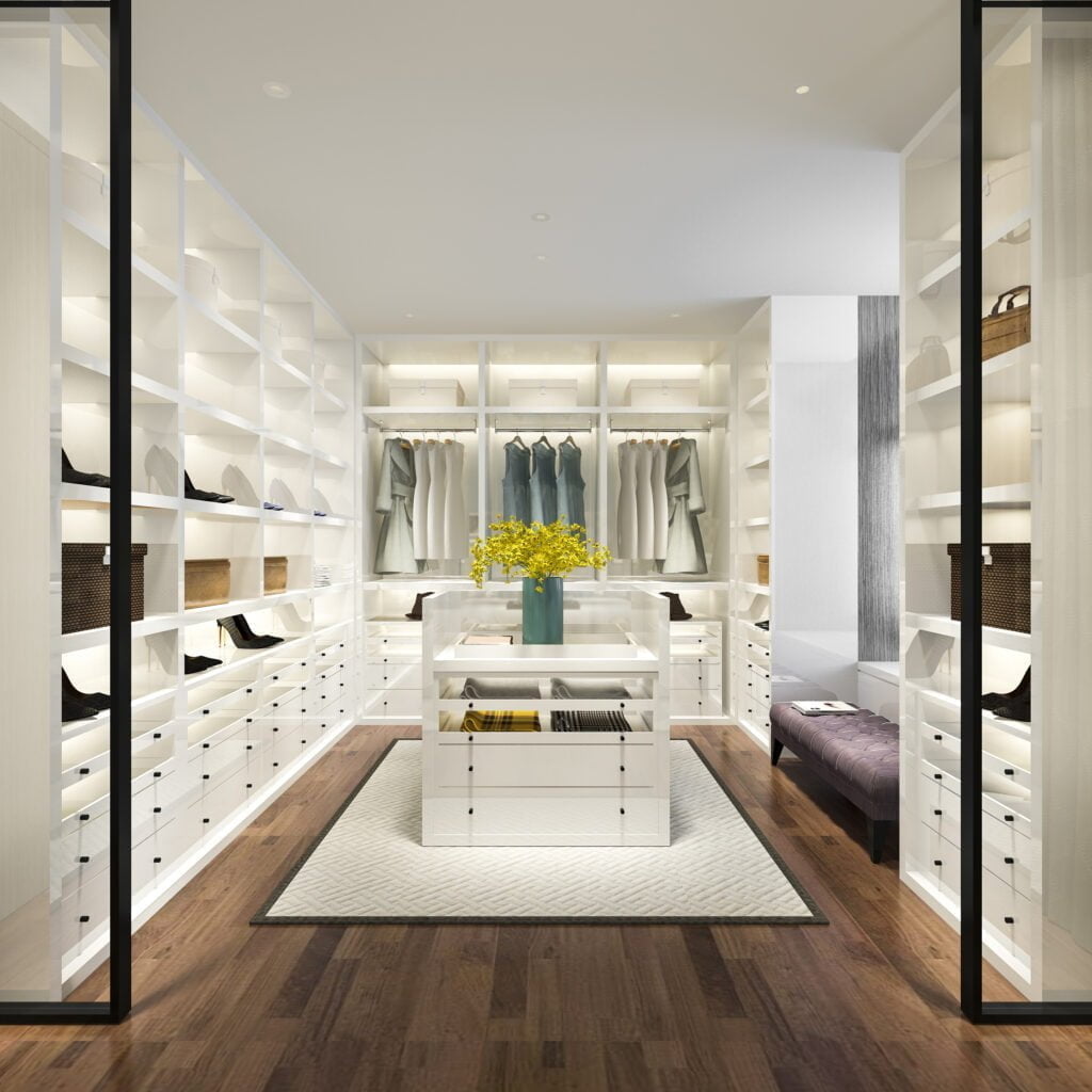 modern luxurious closet that has shelves at every wall and island in the middle