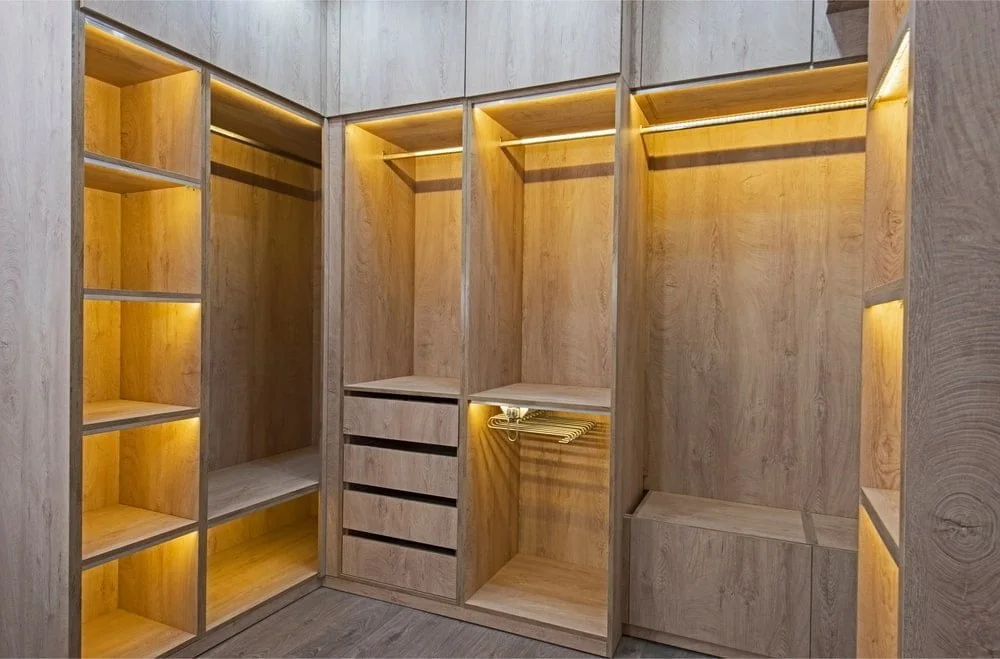 Wooden cabinet with shelves and drawers, lighted with yellow led
