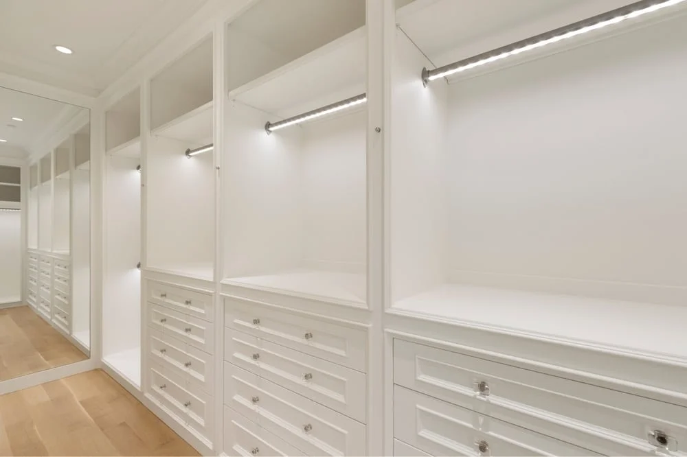 Walk-in closet with large led lighted cabinets