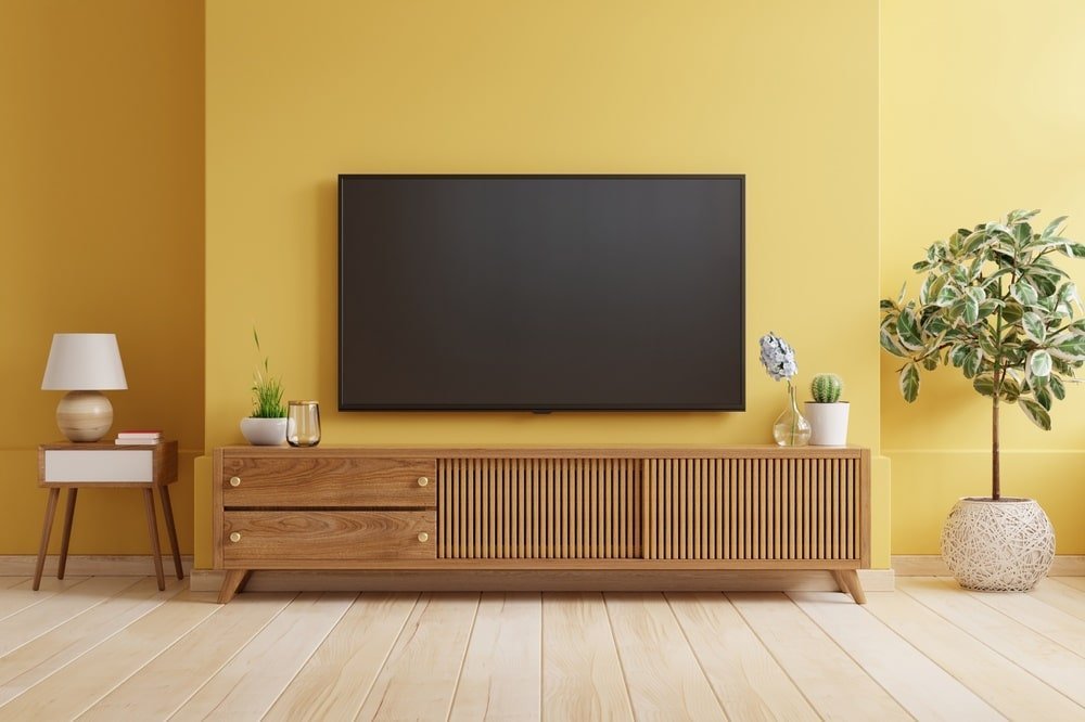 Tv cabinet with drawers and a large tv