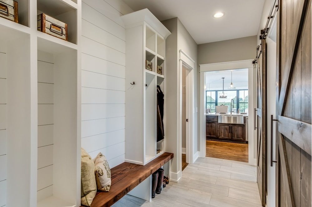 White mudroom design idea with additional furnitures