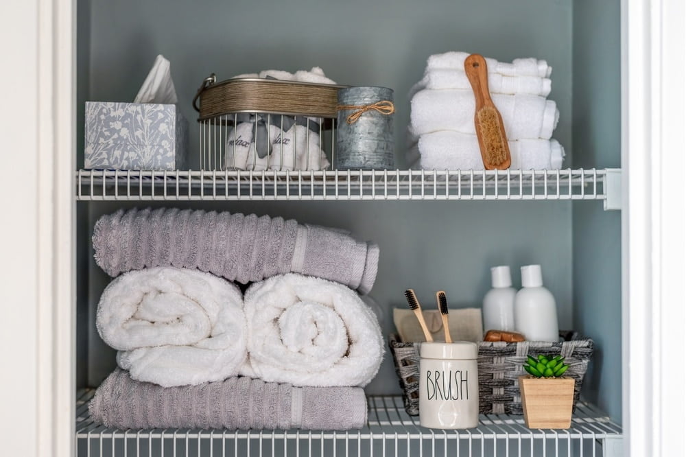 Linen closet shelves with bathroom utensils