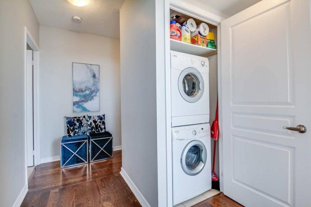 Laundry cabinet with washer dryer and high shelf