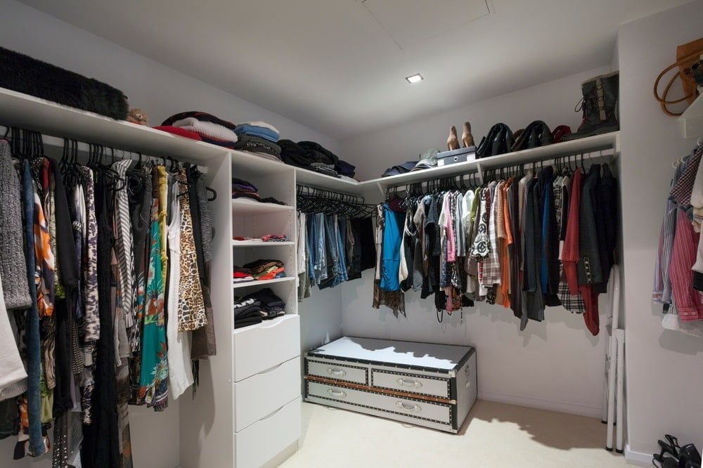 Walk-in closet with hangers, shelves and drawers