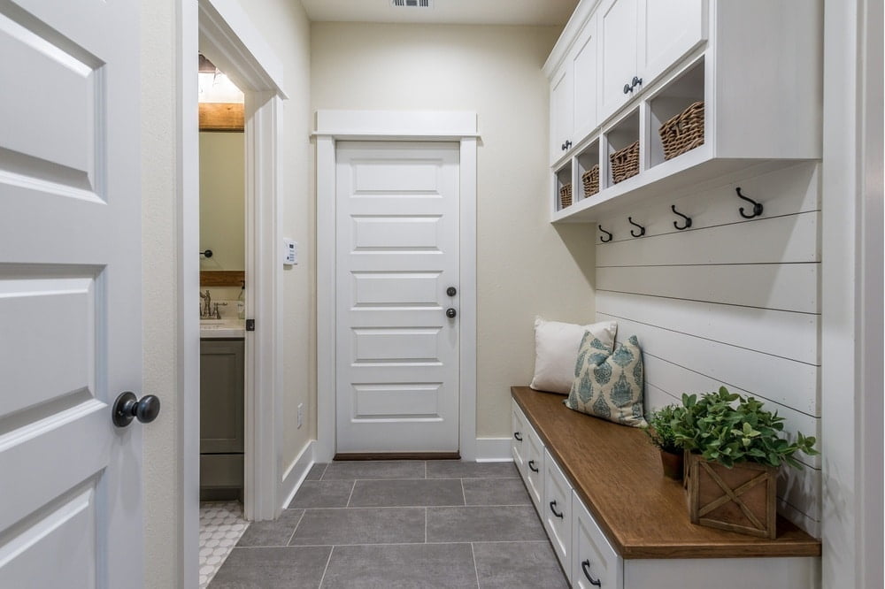 white mudroom with wooden counter