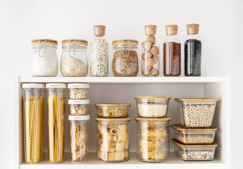 Two white pantry wall shelves preserved food on them