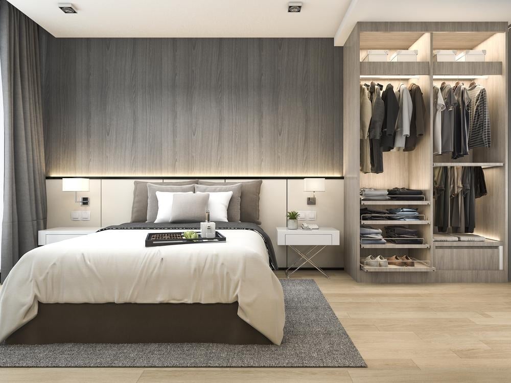 Large luxurious bedroom with open door reach in standing closet