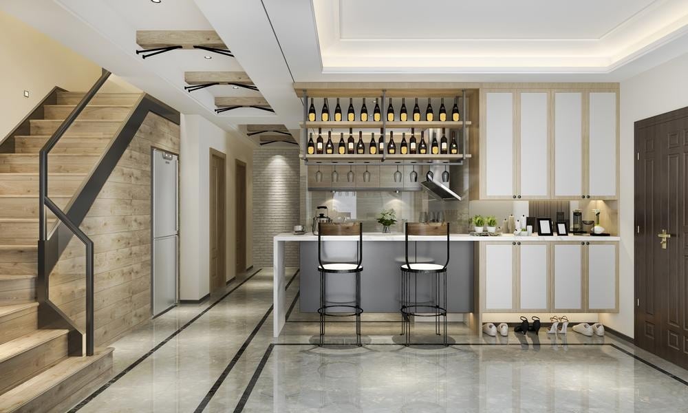 modern wine bar with glass cabinets near the entrance and stairs