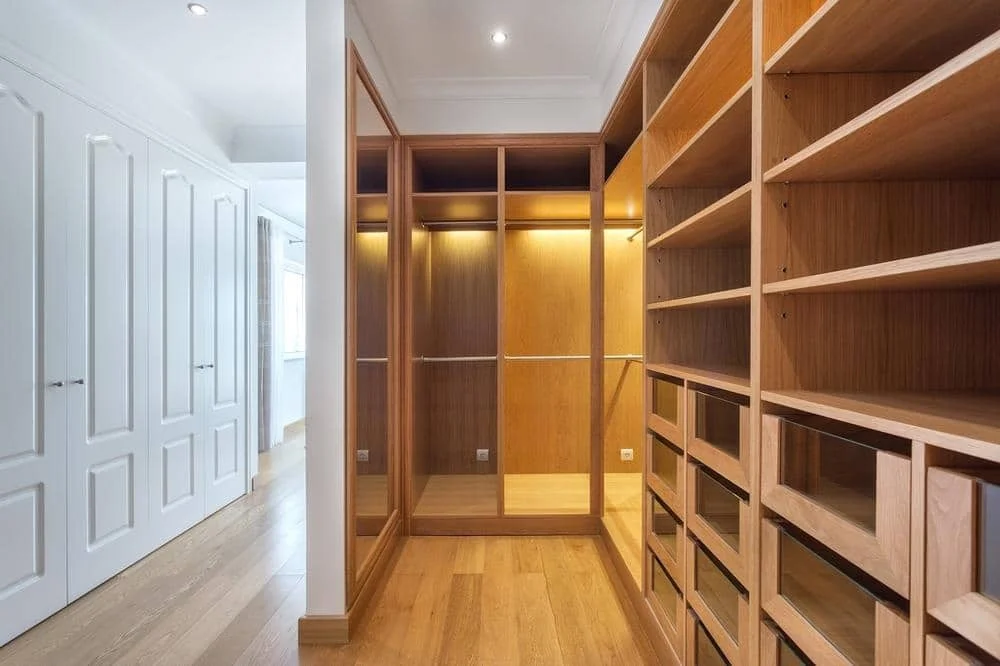 25 Walk-In Closet Ideas for Men to Inspire and Create the Perfect Space 9 Empty wooden walk-in closet ideas for men placed next to a a hallway