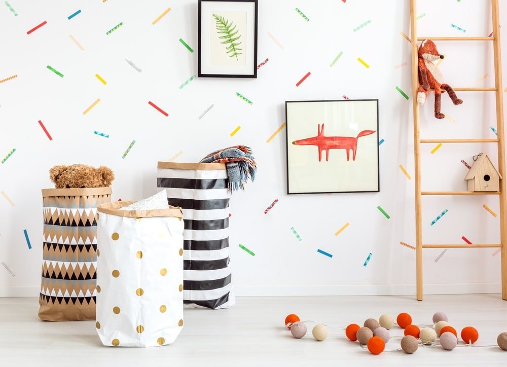 Kids room with wall decorations and colorful paper bags