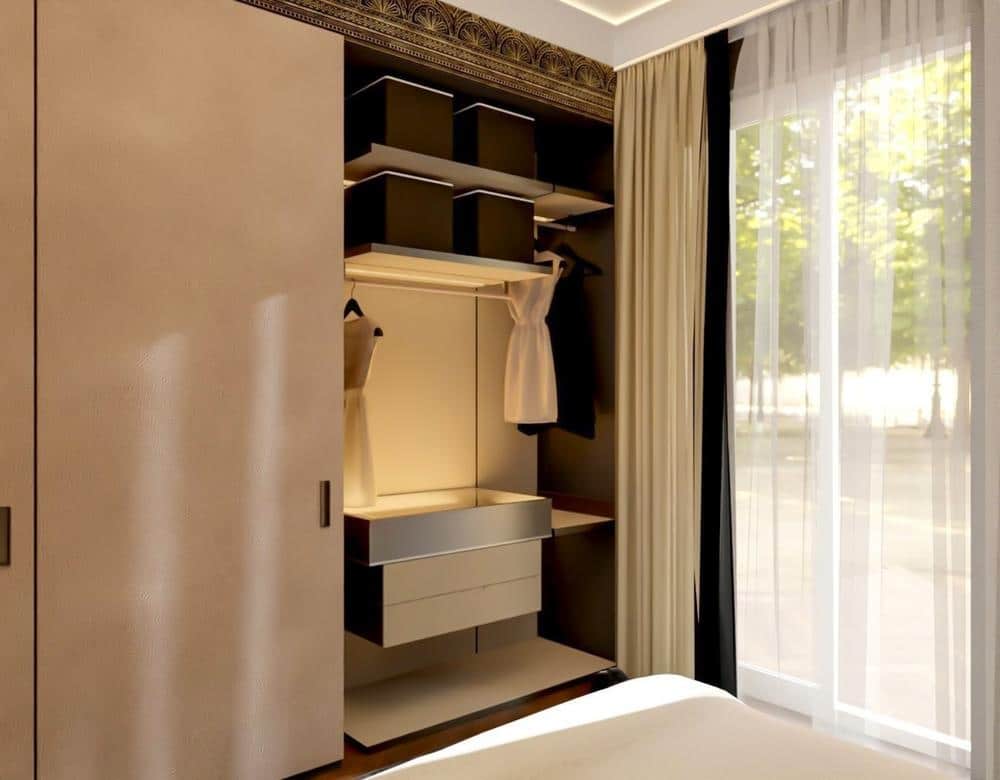 Walk in closet with a large window and open door closet