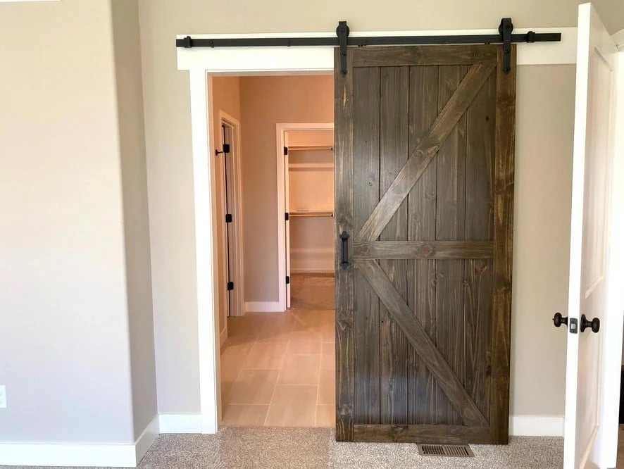 Step into Style: Knock them Dead with These 20 Eye-Catching Closet Door Ideas! 4 Walk in closet with sliding barn door
