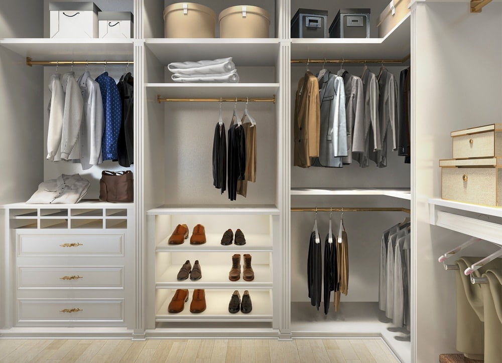 White walk in closet with open sections and clothing hangers