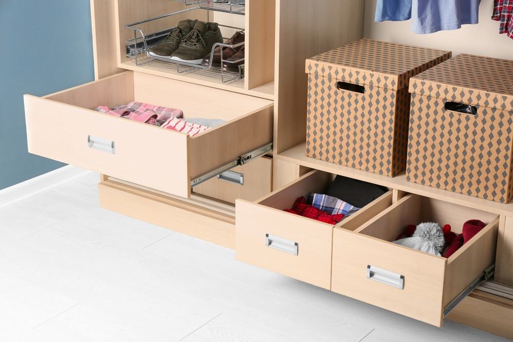 Space-saving ideas
wooden cabinet with open drawers and storage boxes
