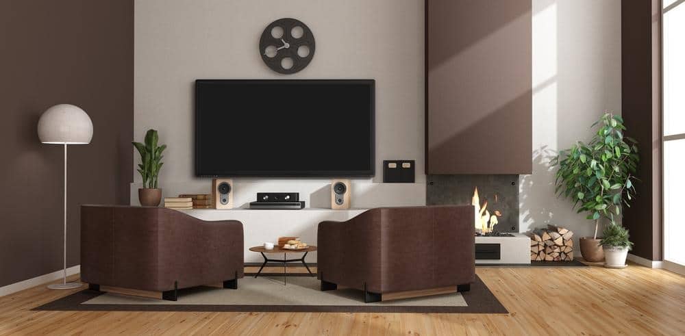 Modern living room with brown accent walls and tv and fireplace