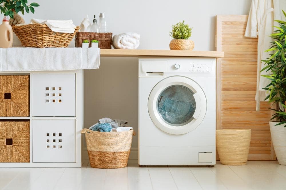 Laundry room with wooden storage drawers and baskets