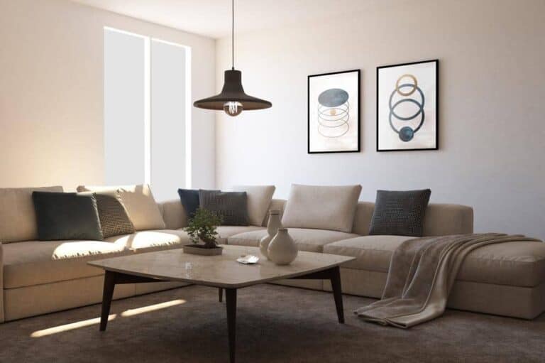 Simple designed living room with l shaped couch and two wall decor