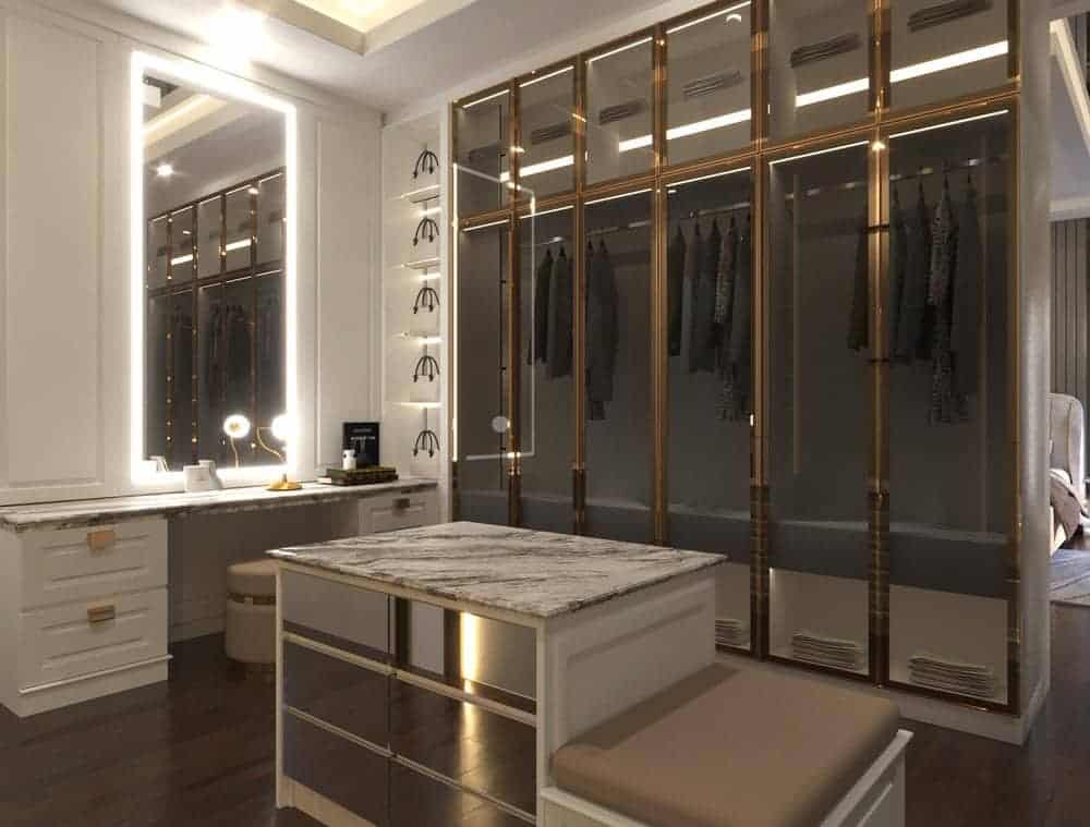 Small walk in closet with luxury closets and led lighted mirror on the wall
