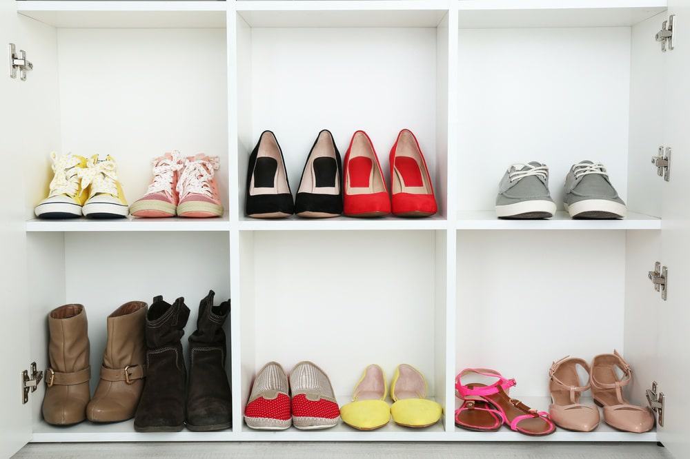 White shoe closet with shoes inside