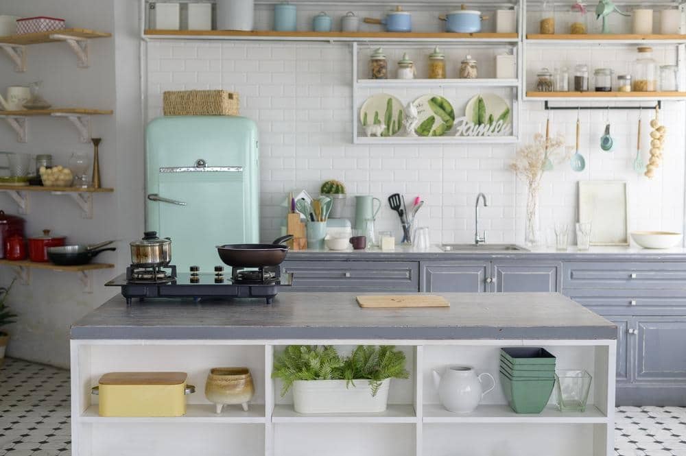 Vintage kitchen with open shelves and light blue fridge