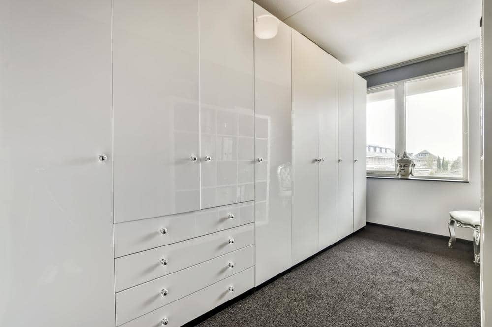 White large wardrobe with closed white doors