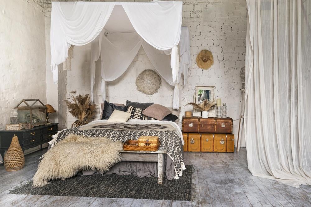 Rustic farmhouse bedroom with canopy bed and rustic decorations