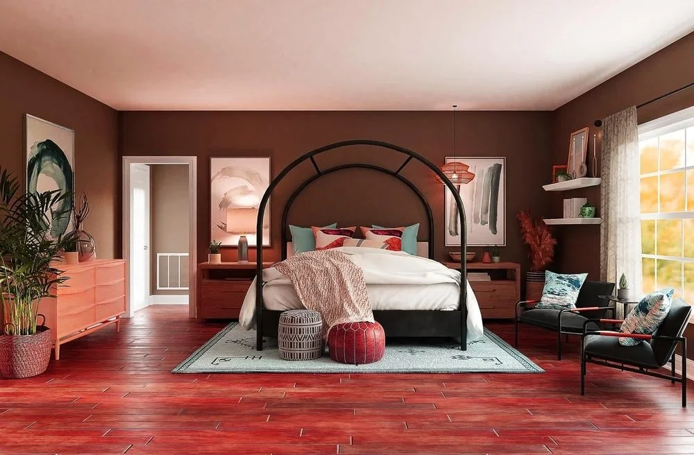 Red wooden floor bedroom with a black framed bed and white rug under that