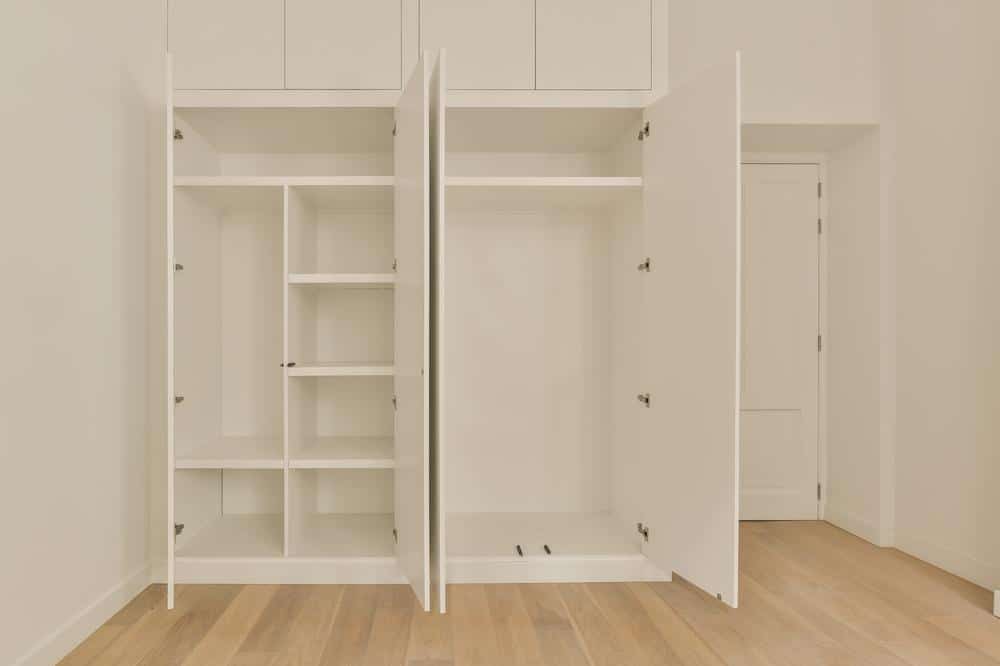 White empty built in closet with shelves