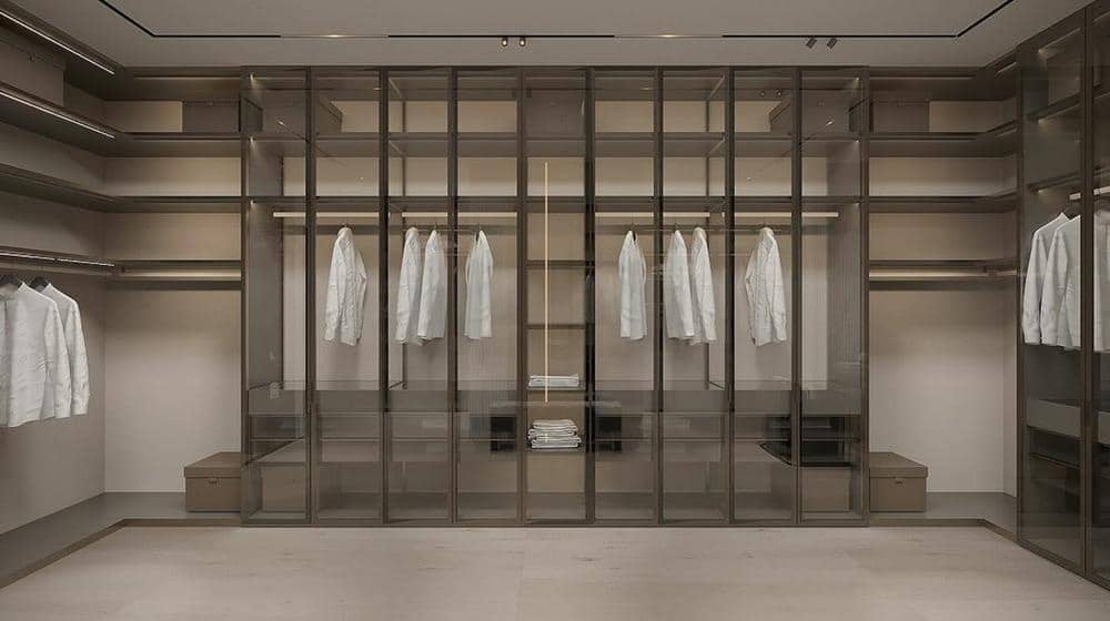 Large glass door built in closet system with open shelves and rods