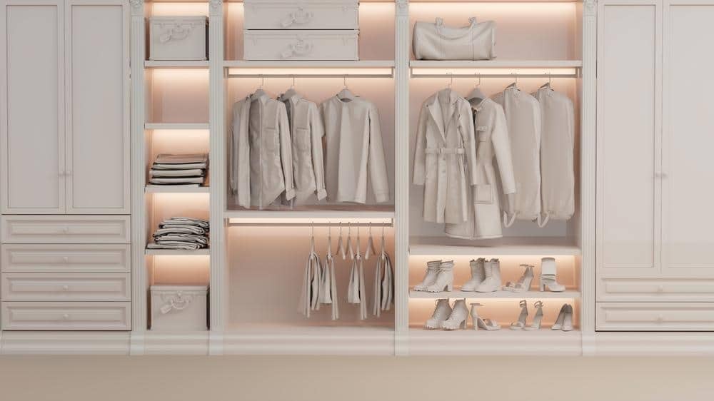 All white and led lighted wardrobe closet with rods