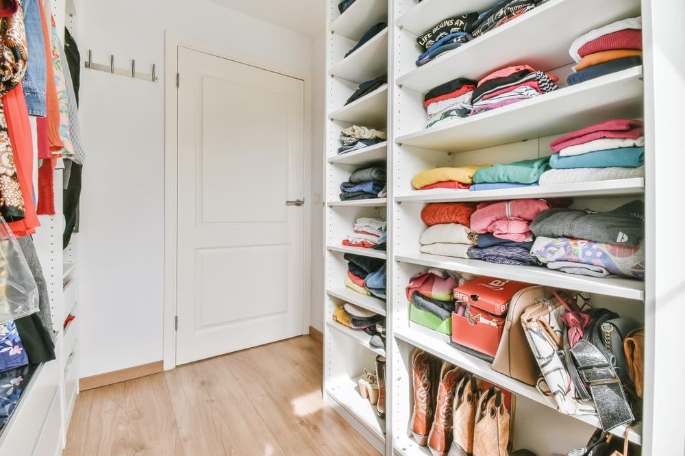 Custom white closet with open shelves