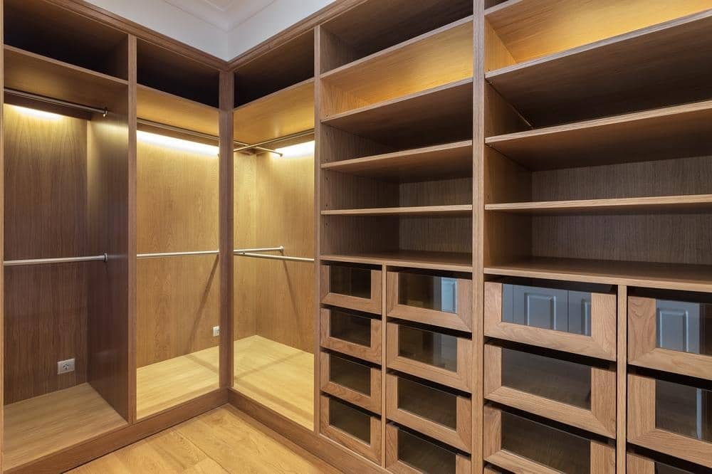 Walk in closet with open shelves and hanging spaces