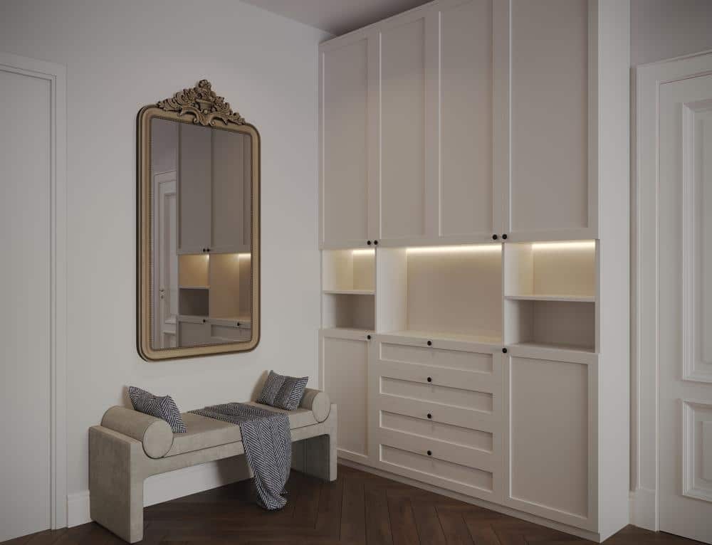Small white custom closet in a room with dim lighting