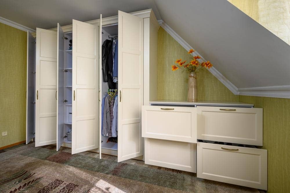 White built in closet with drawers and open doors